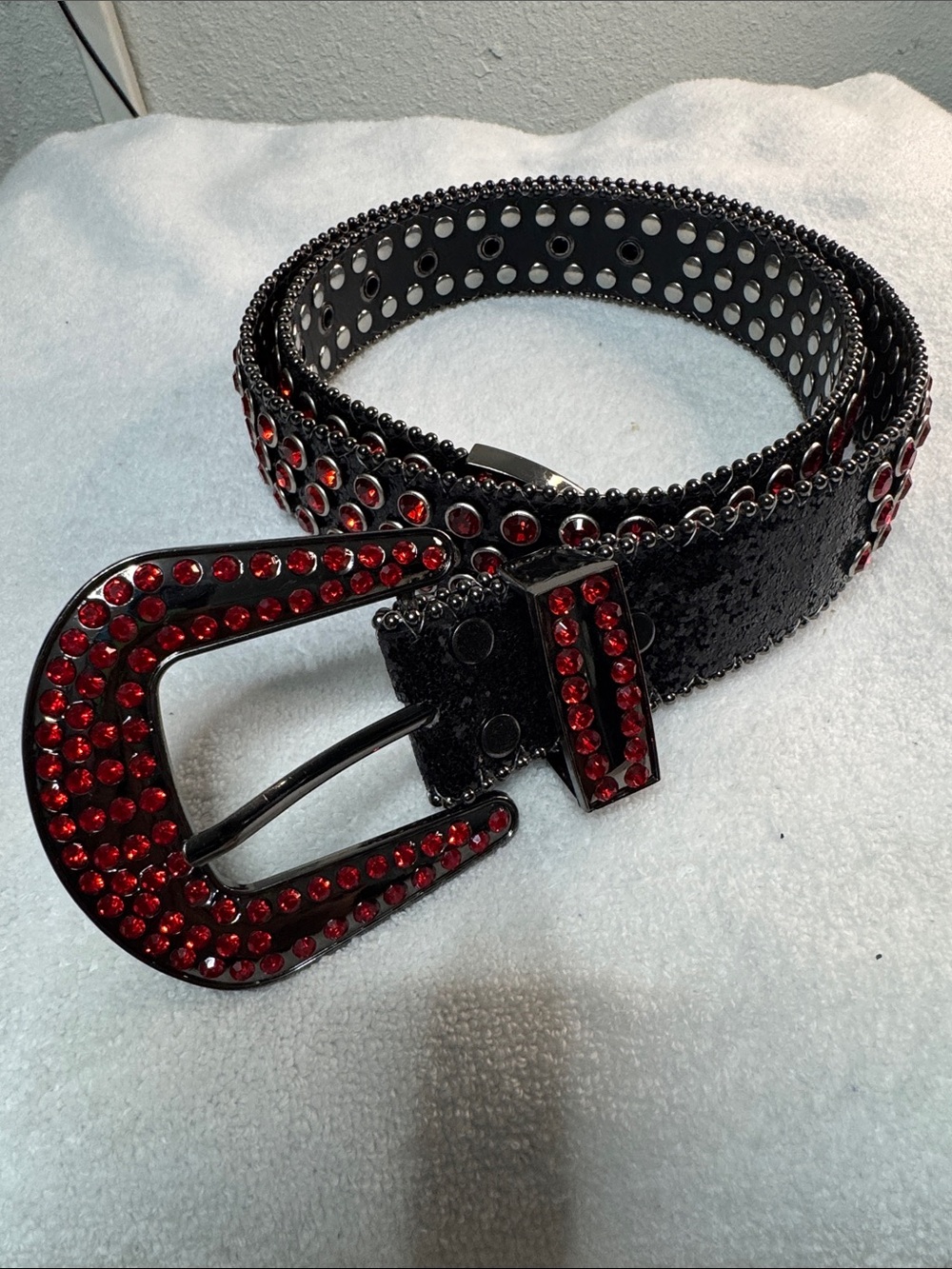 Black belt with red rhinestone